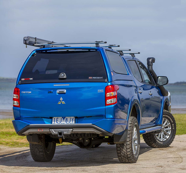 Бампер задний силовой с интегрированным фаркопом для Mitsubishi L200 (2006-2015)